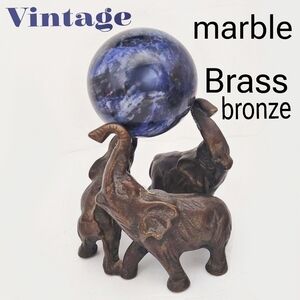 Vintage 1990s brass or bronze elephants with real marple sphere